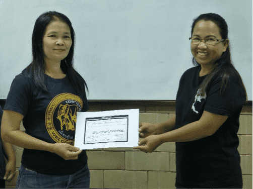 Mrs. Jirawat Keandlaw is presented with the certificate from SED’s Director of Field Operations.