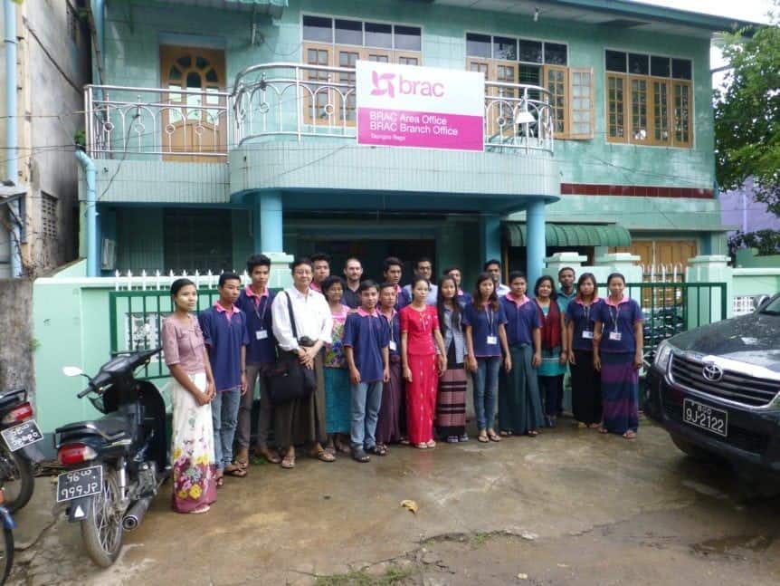 staff at BRAC myanmar standing in front of the branch office