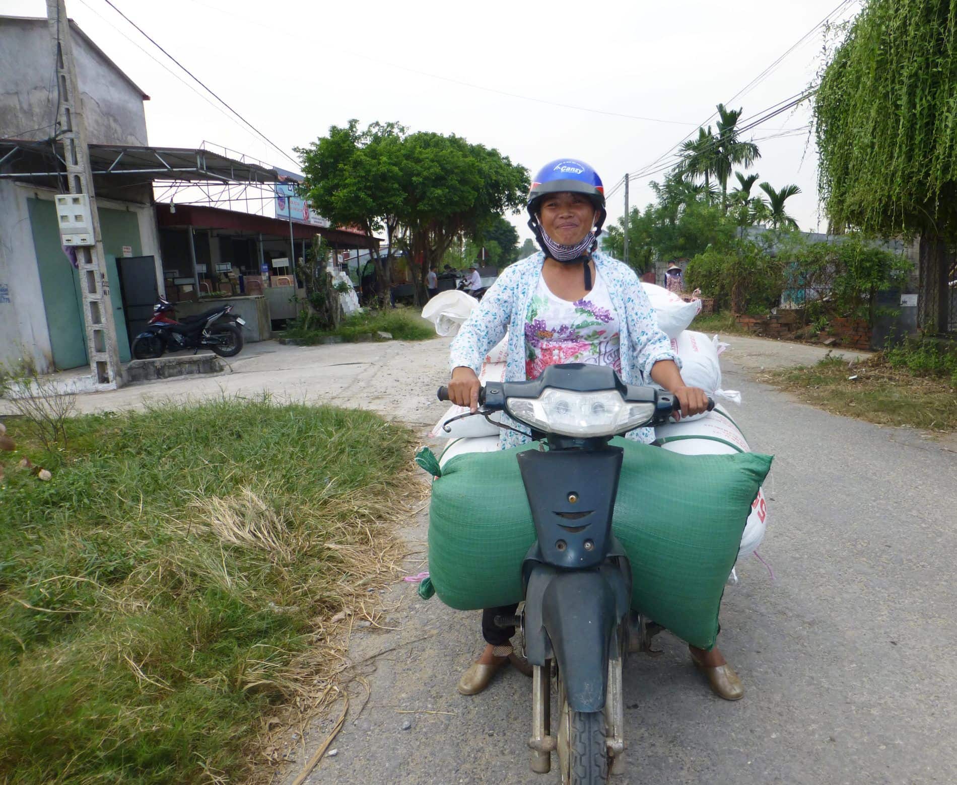 Loan on scooter with rice in Vietnam