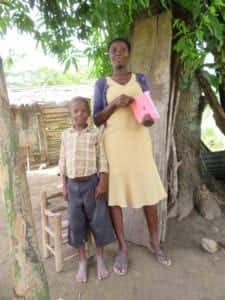 microcredit client and her child in Haiti