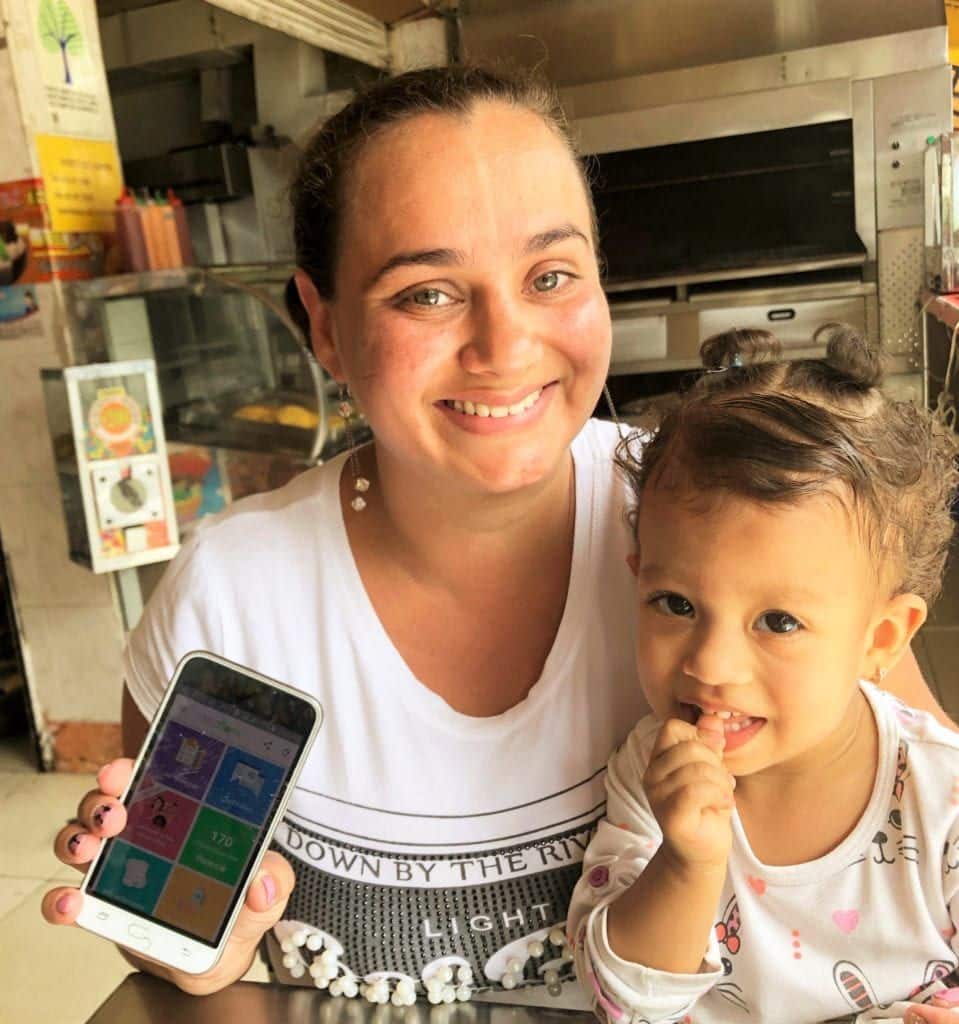a woman and her son with a cell phone in colombia