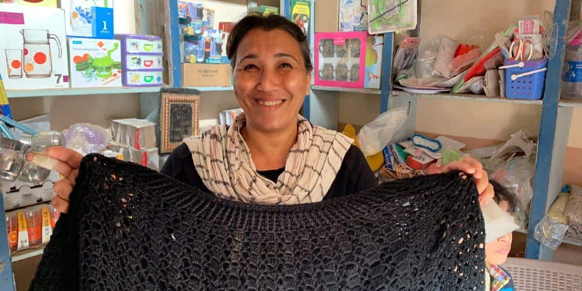 a microcredit client in her shop in egypt