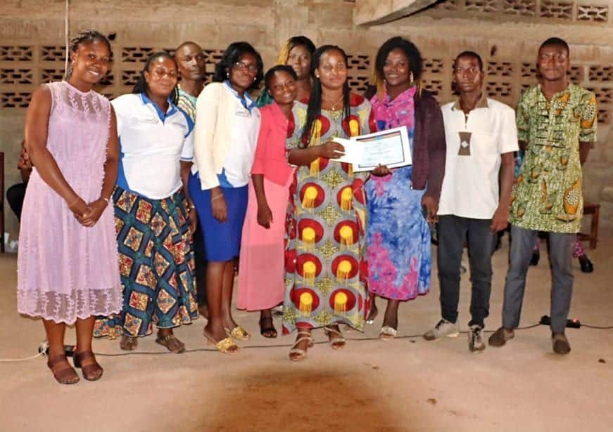 award recipient and staff of mfi in togo