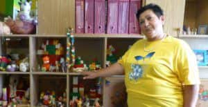 woman standing in front of toys and books