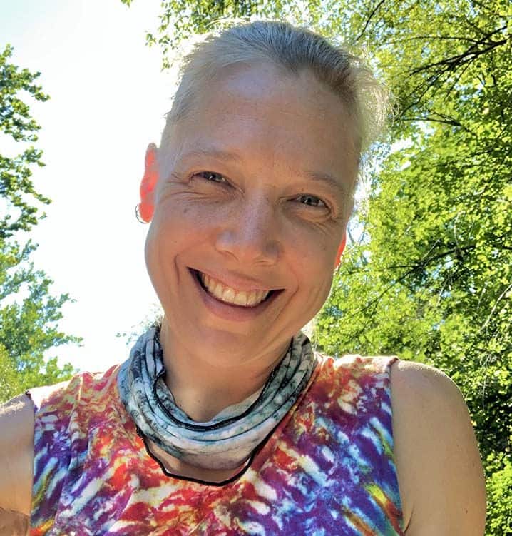 a woman in a tie dye top